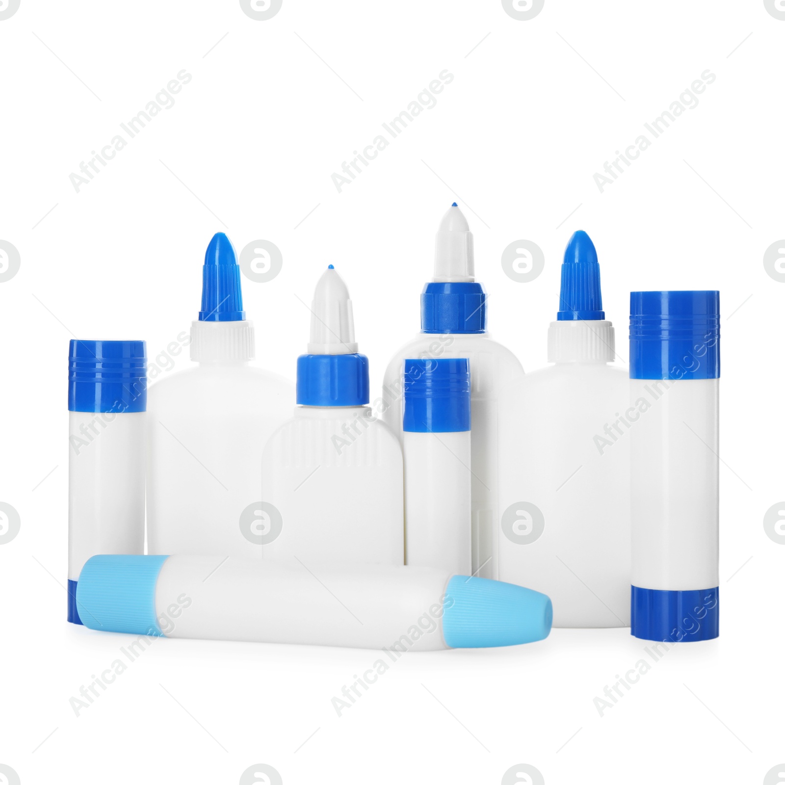 Photo of Bottles and sticks of glue on white background