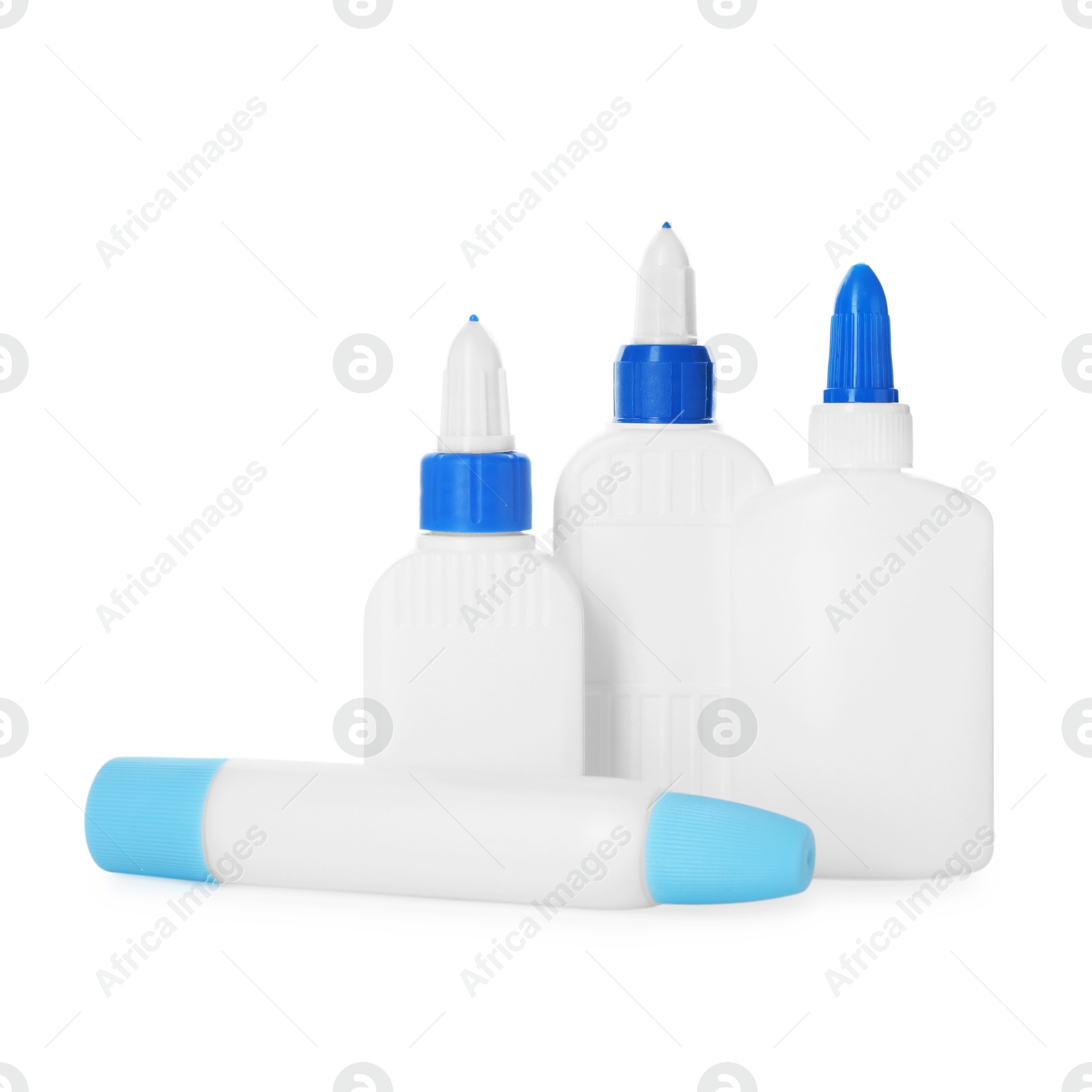 Photo of Bottles and sticks of glue on white background