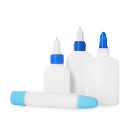 Photo of Bottles and sticks of glue on white background