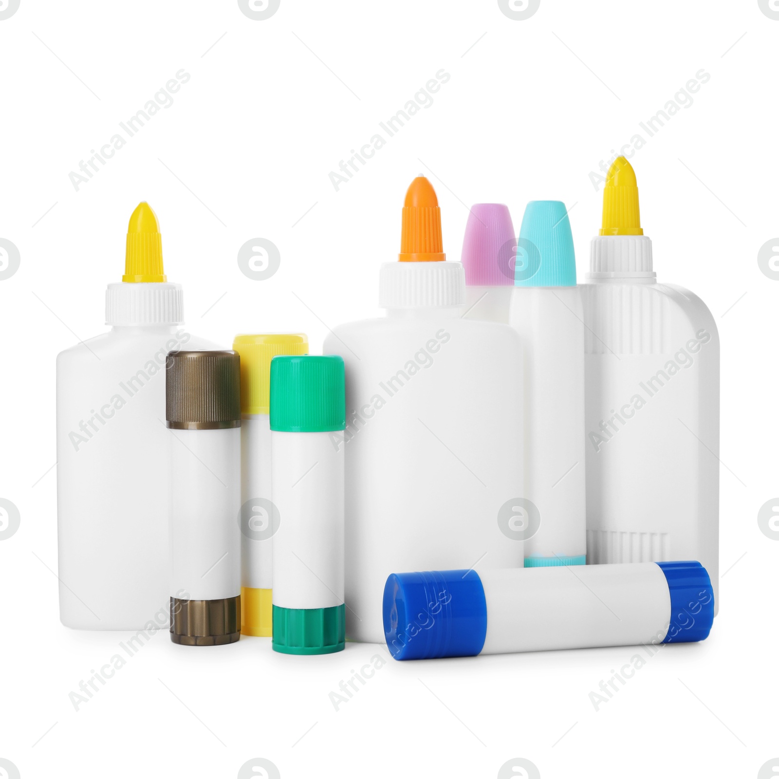 Photo of Bottles and sticks of glue on white background