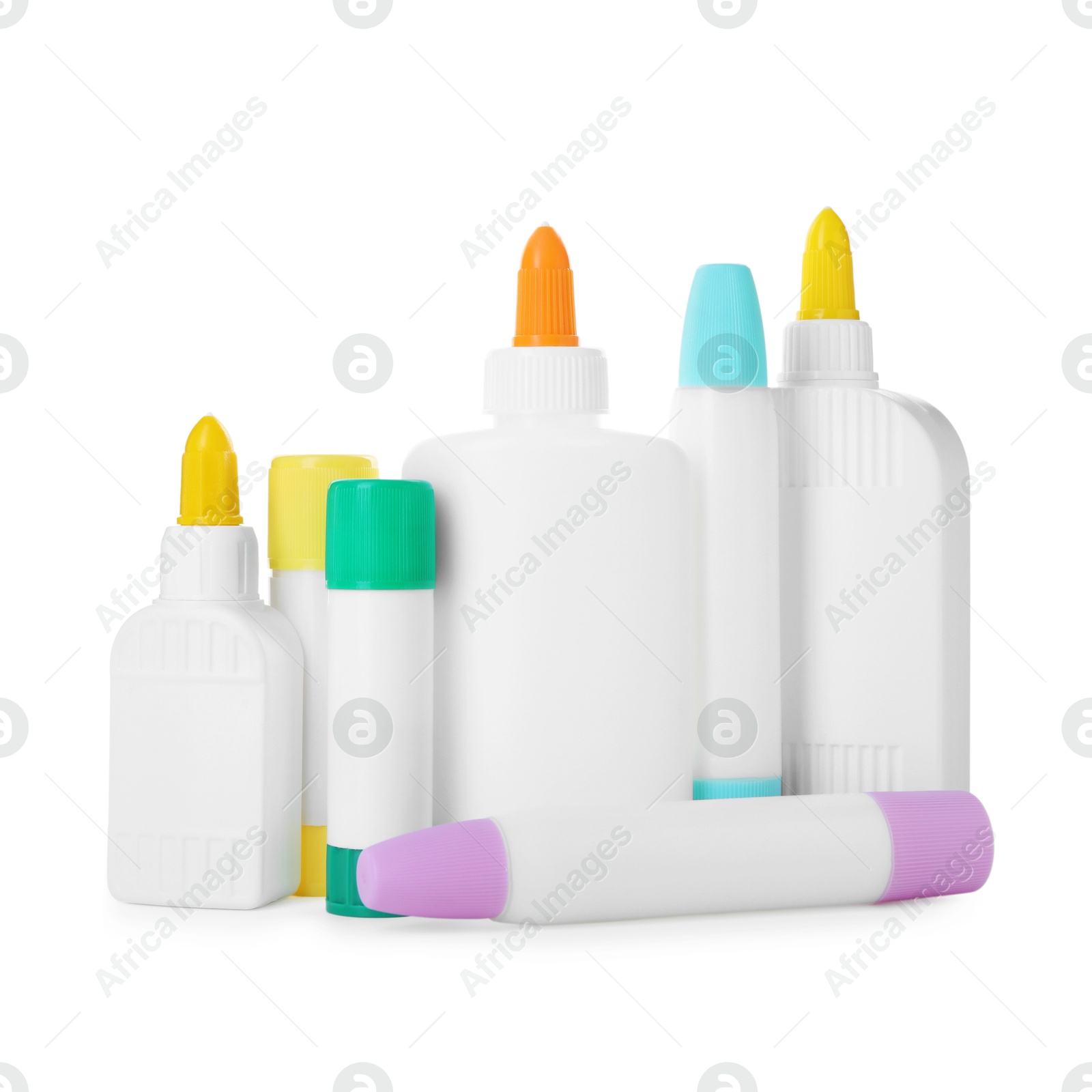 Photo of Bottles and sticks of glue on white background