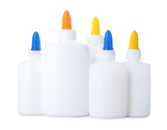 Photo of Many bottles of glue isolated on white