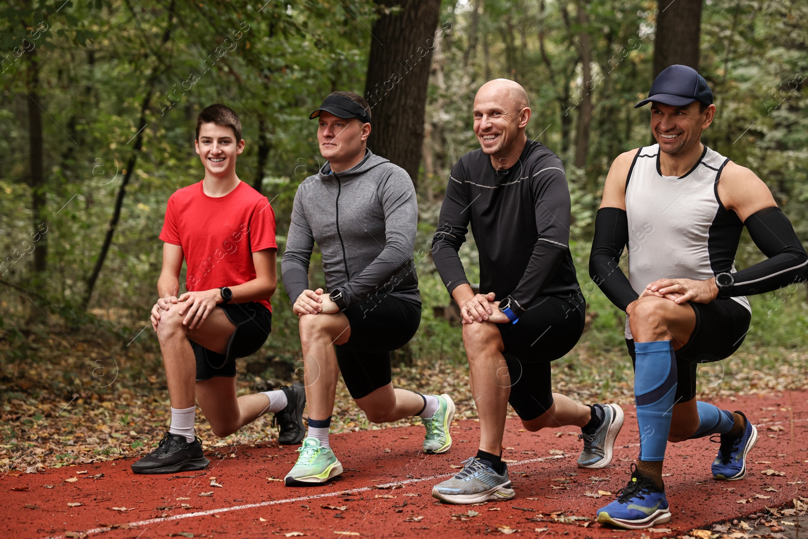 Photo of Group of people stretching in park. Healthy lifestyle