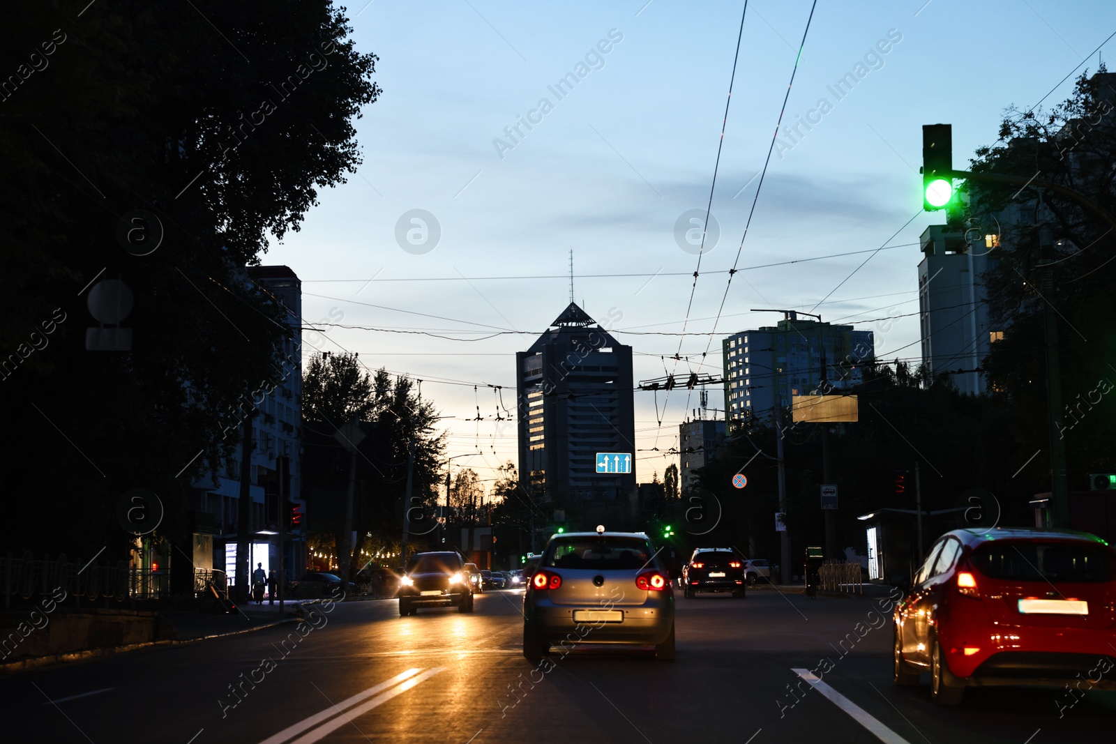 Photo of Cityscape with road traffic and street lights in evening