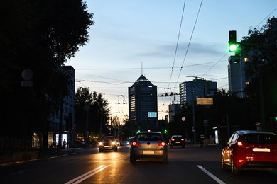 Photo of Cityscape with road traffic and street lights in evening