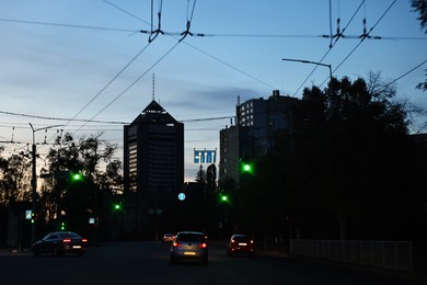 Photo of Cityscape with road traffic and street lights in evening