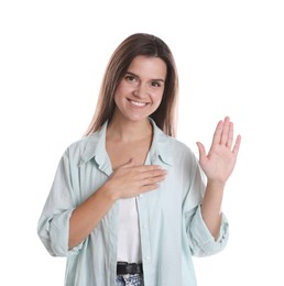 Photo of Woman making promise with raised hand on white background. Oath gesture