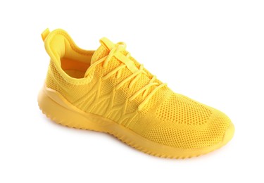 Photo of One stylish yellow sneaker isolated on white