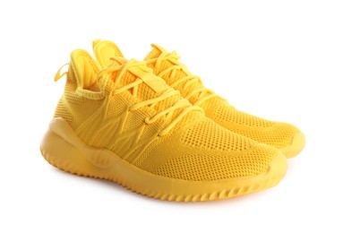 Photo of Pair of stylish yellow sneakers isolated on white