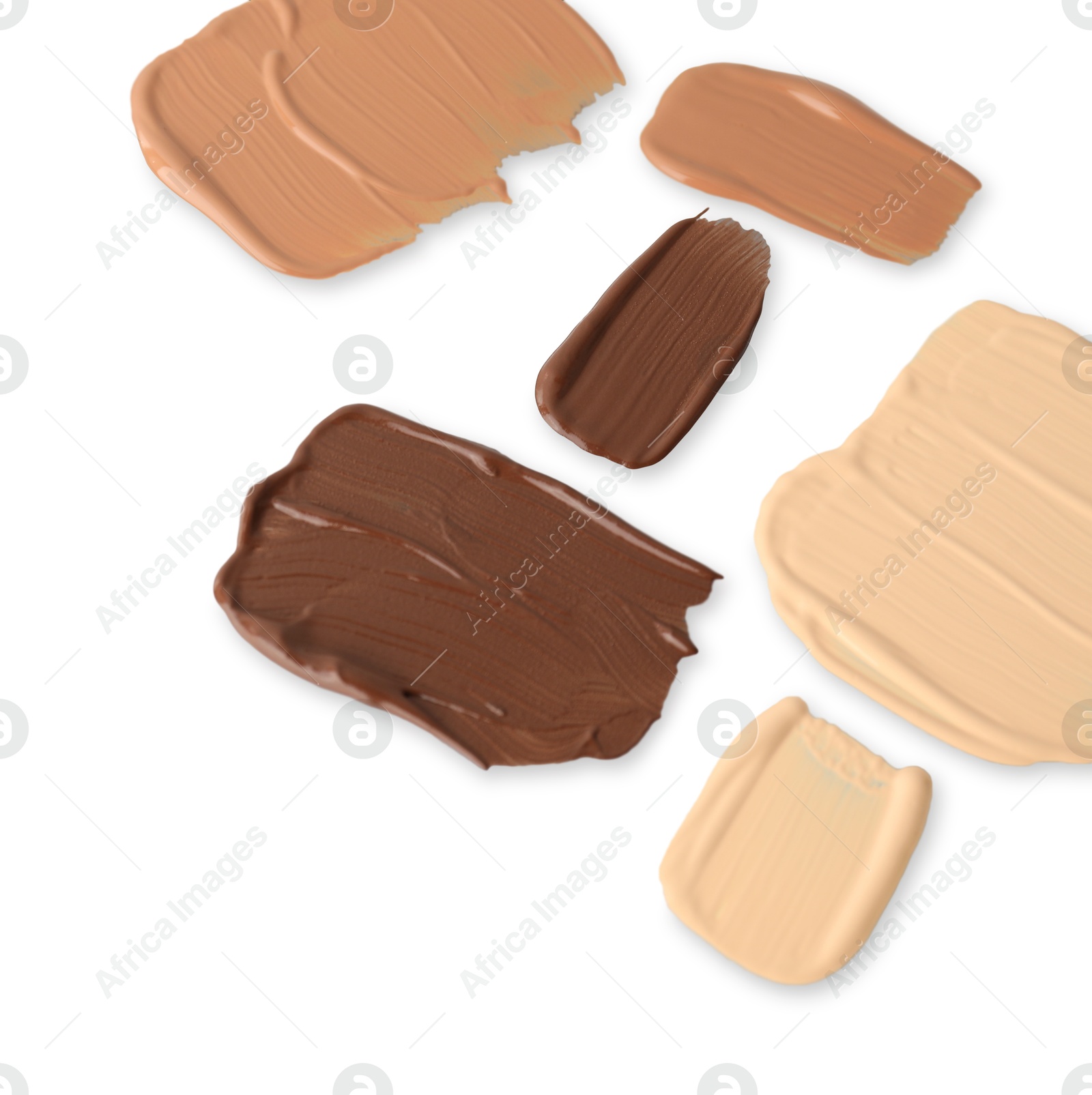 Photo of Samples of different foundations isolated on white