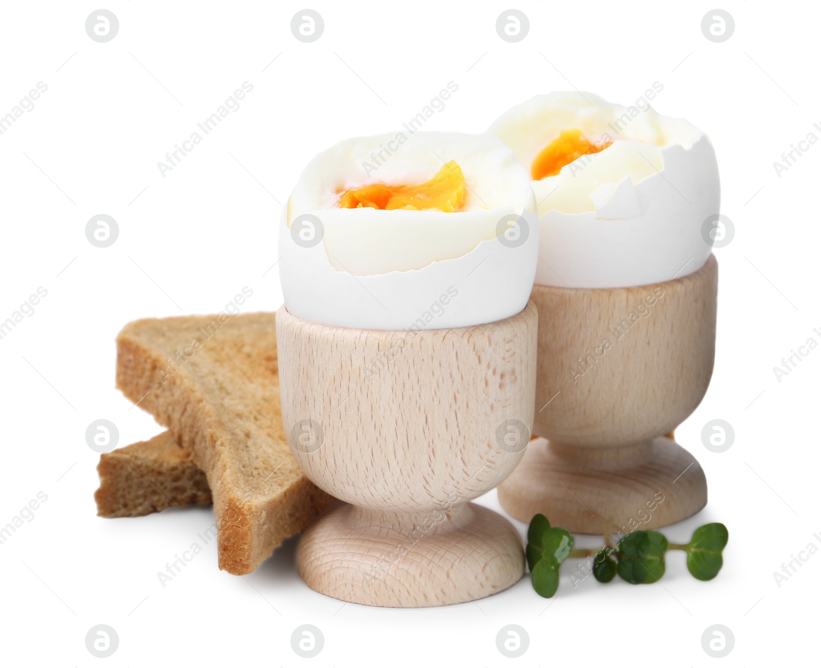 Photo of Soft boiled eggs and bread isolated on white