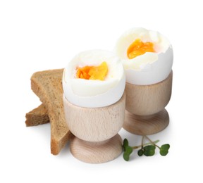 Photo of Soft boiled eggs and bread isolated on white