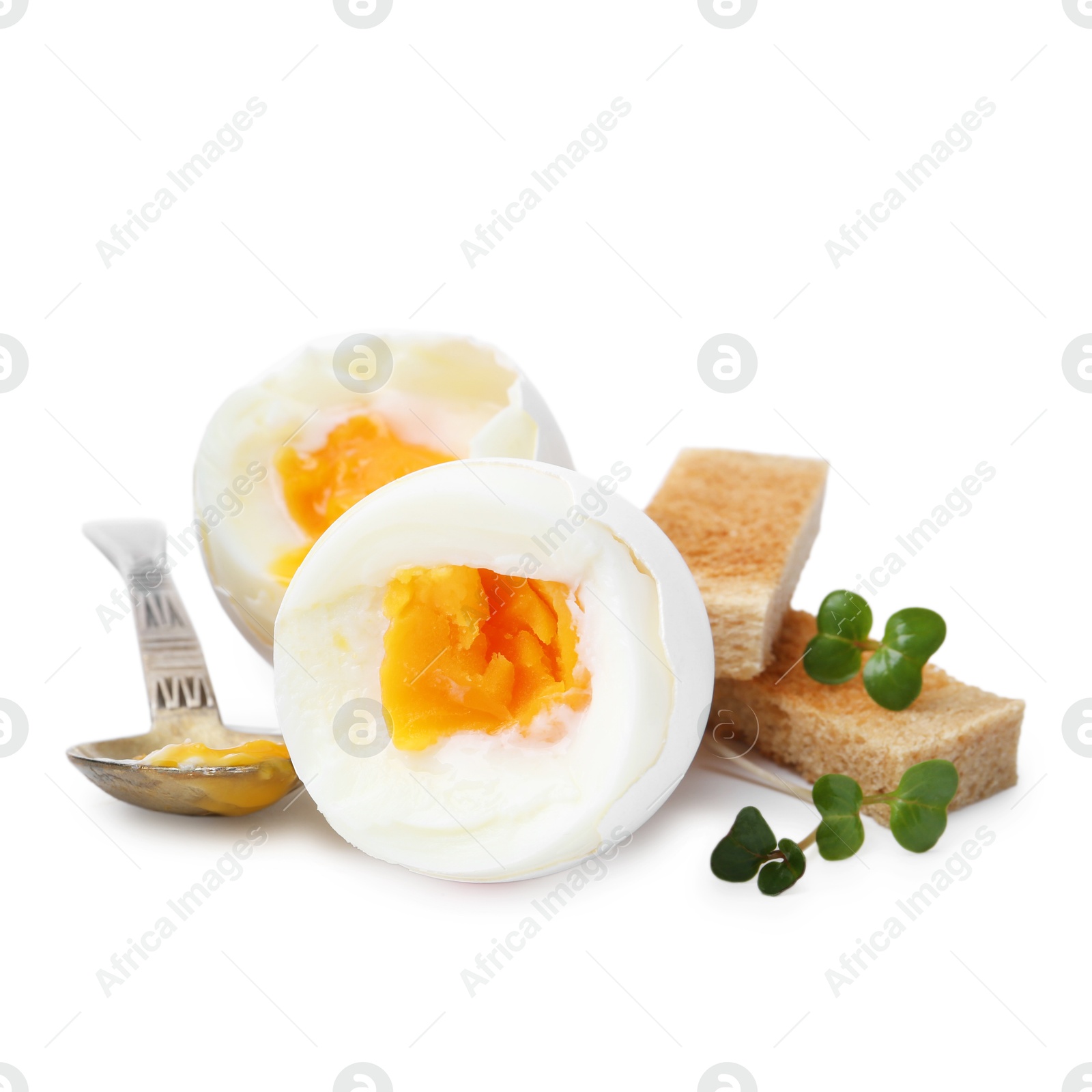 Photo of Soft boiled eggs, bread and spoon isolated on white