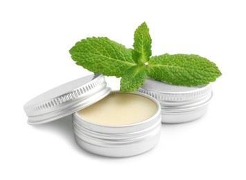 Photo of Mint lip balms and green leaves isolated on white. Cosmetic product