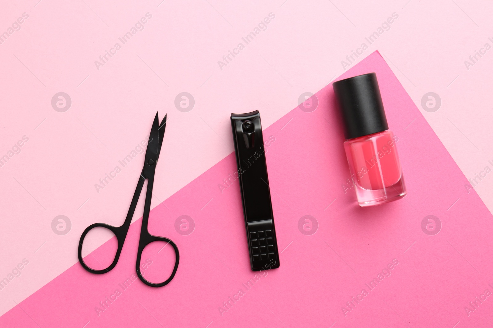 Photo of Set of pedicure tools on color background, flat lay