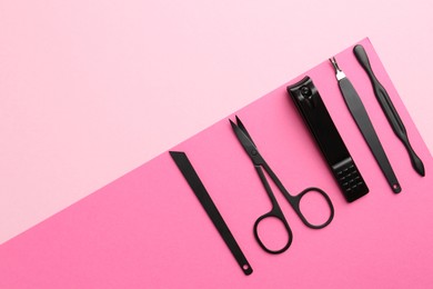 Photo of Set of pedicure tools on color background, flat lay. Space for text