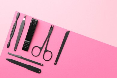 Photo of Set of pedicure tools on color background, flat lay. Space for text