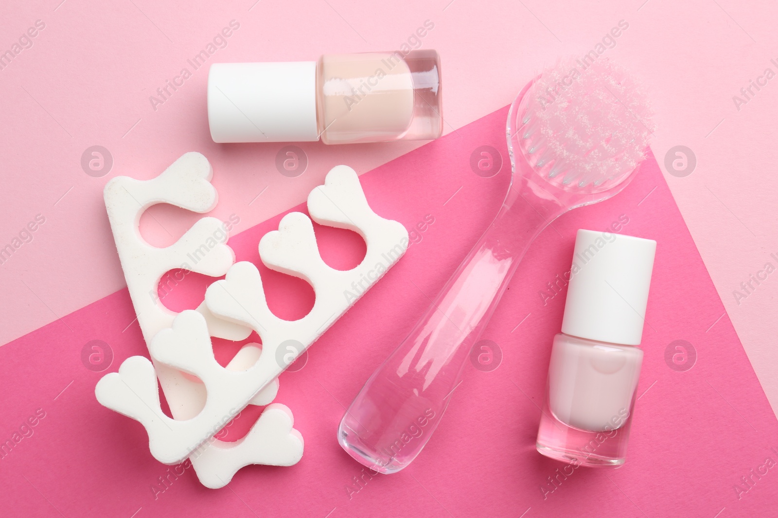 Photo of Set of pedicure tools on color background, flat lay