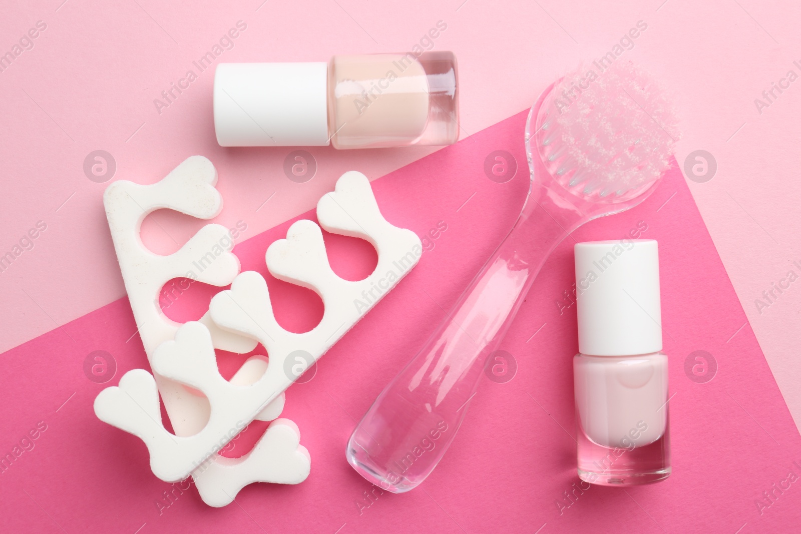 Photo of Set of pedicure tools on color background, flat lay