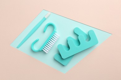 Photo of Set of pedicure tools on color background, flat lay