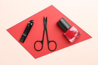 Photo of Set of pedicure tools on color background, flat lay