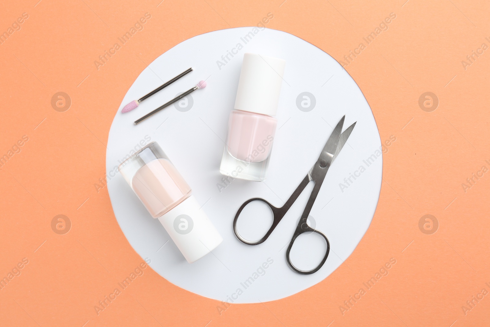 Photo of Set of pedicure tools on color background, flat lay