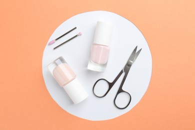 Photo of Set of pedicure tools on color background, flat lay