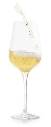 Photo of Tasty wine splashing in glass on white background