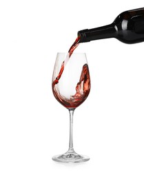 Photo of Pouring wine into glass on white background