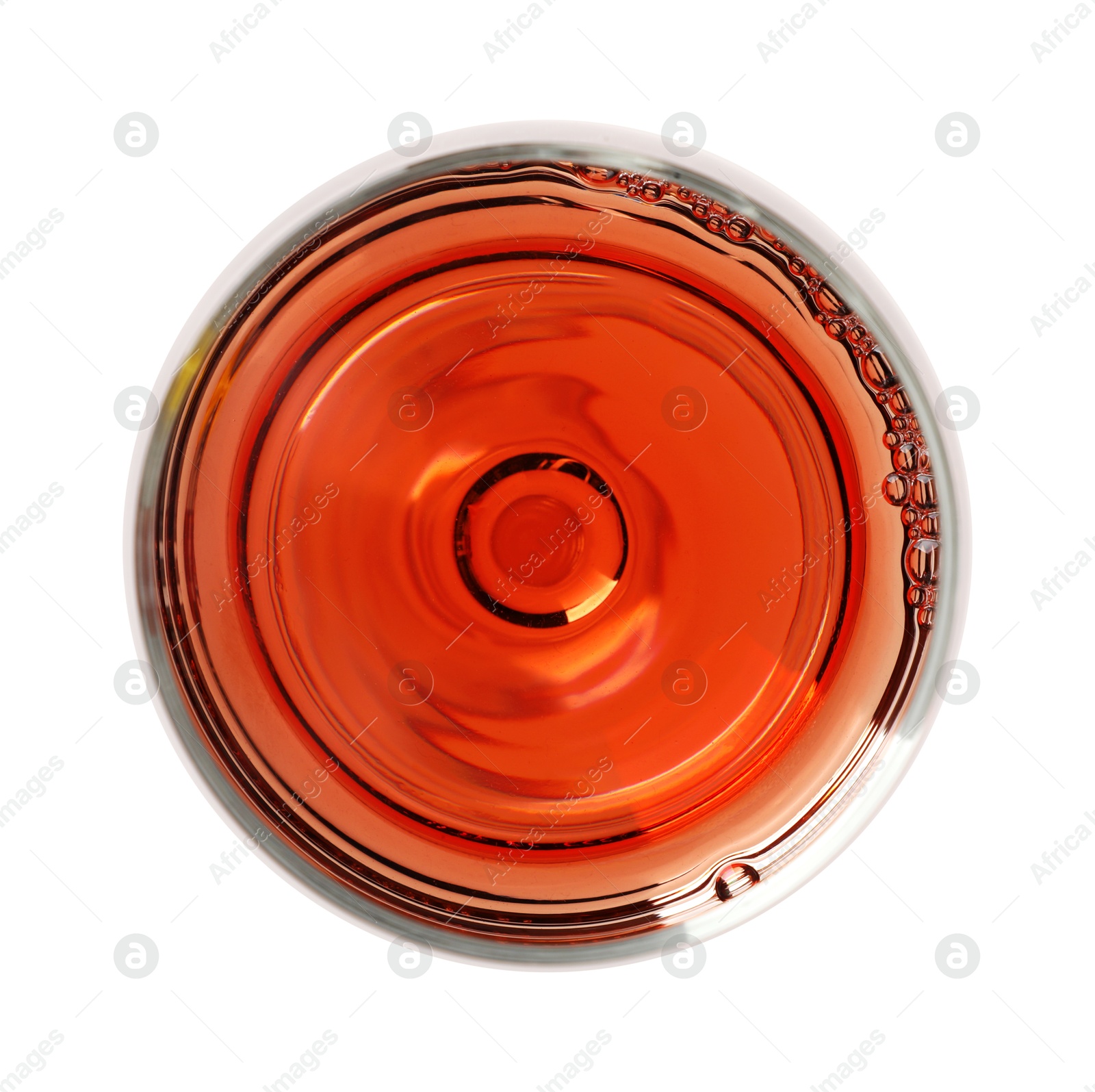 Photo of Rose wine in glass isolated on white, top view