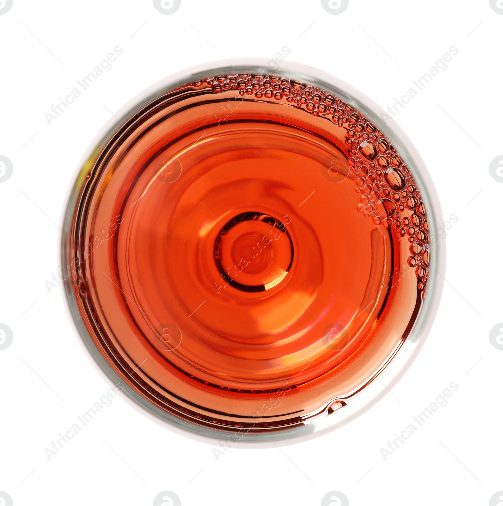 Photo of Rose wine in glass isolated on white, top view