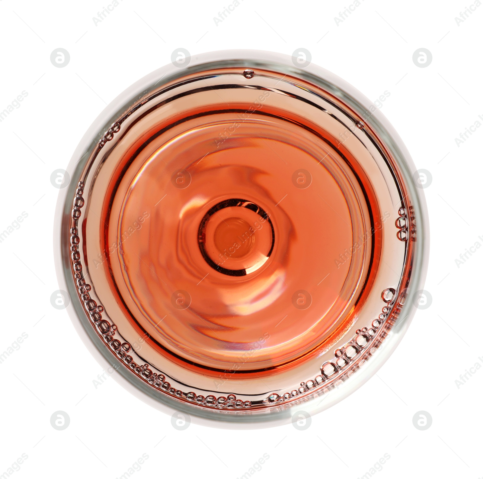 Photo of Rose wine in glass isolated on white, top view