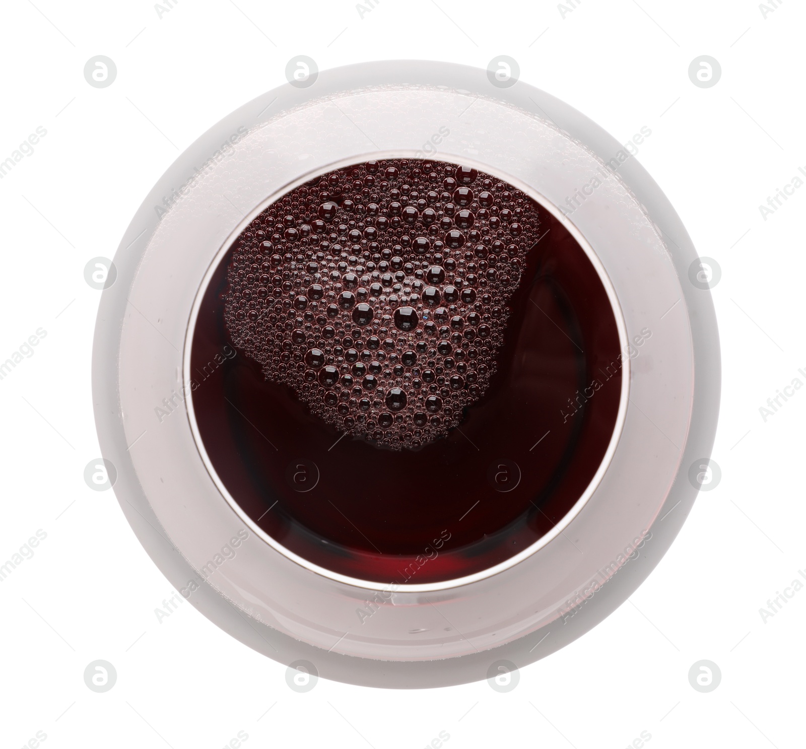 Photo of Red wine in glass isolated on white, top view