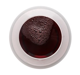 Photo of Red wine in glass isolated on white, top view