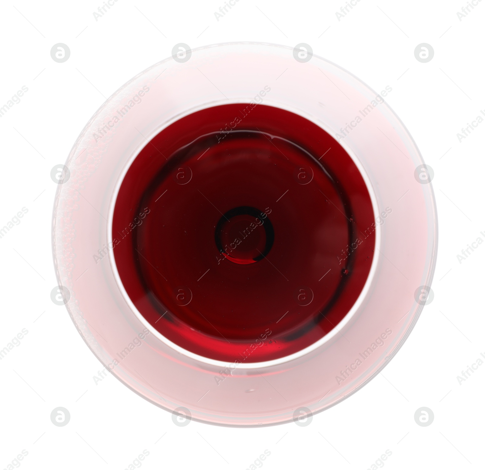 Photo of Red wine in glass isolated on white, top view