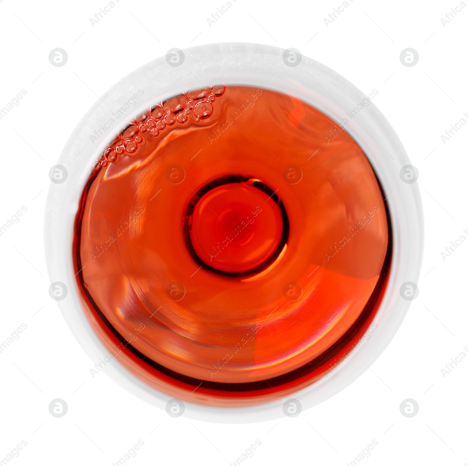 Photo of Rose wine in glass isolated on white, top view