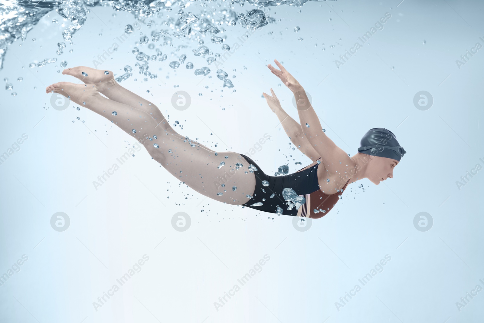 Image of Woman wearing swimsuit swimming in water. Aquatic sport