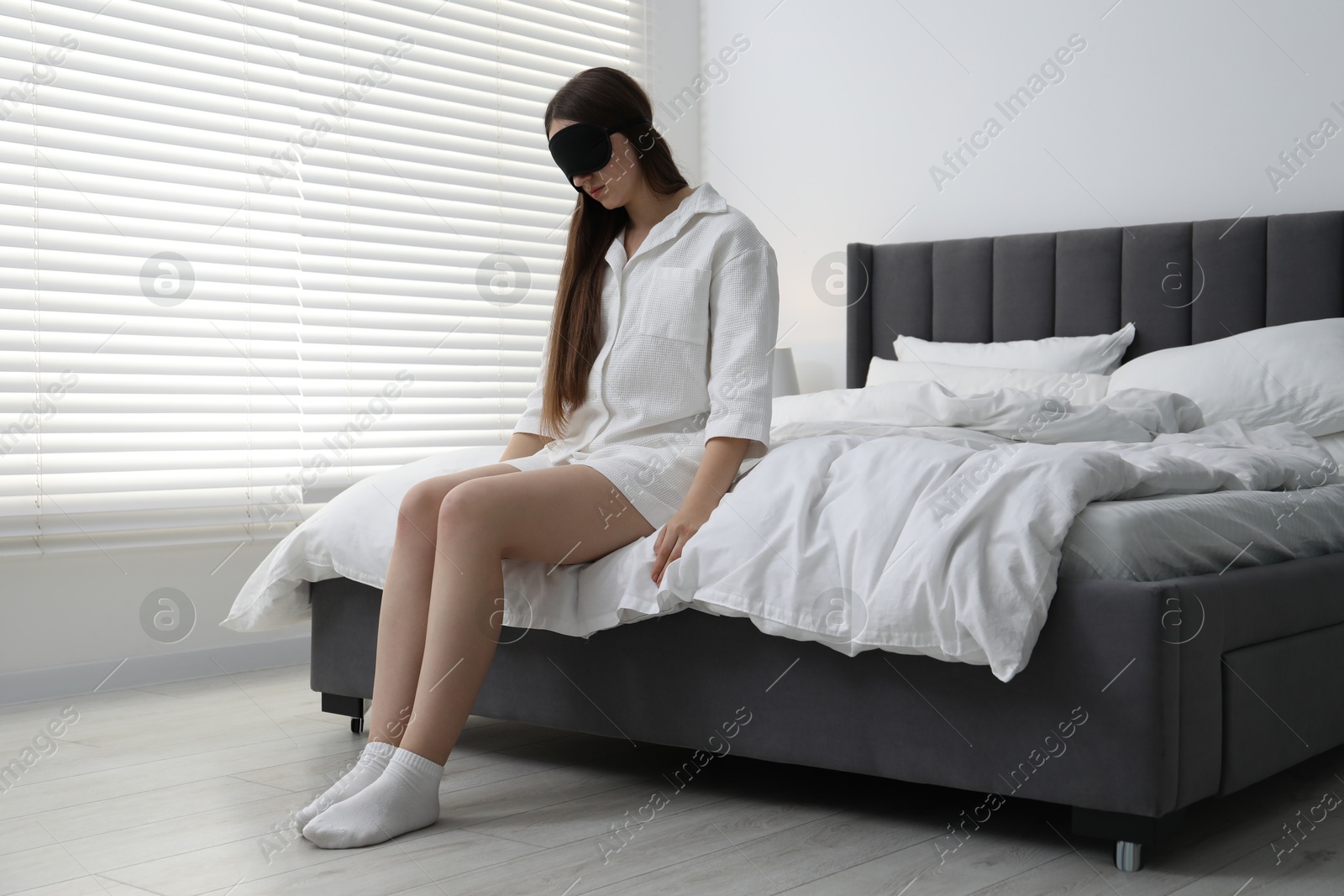 Photo of Young woman suffering from sleepwalking at home