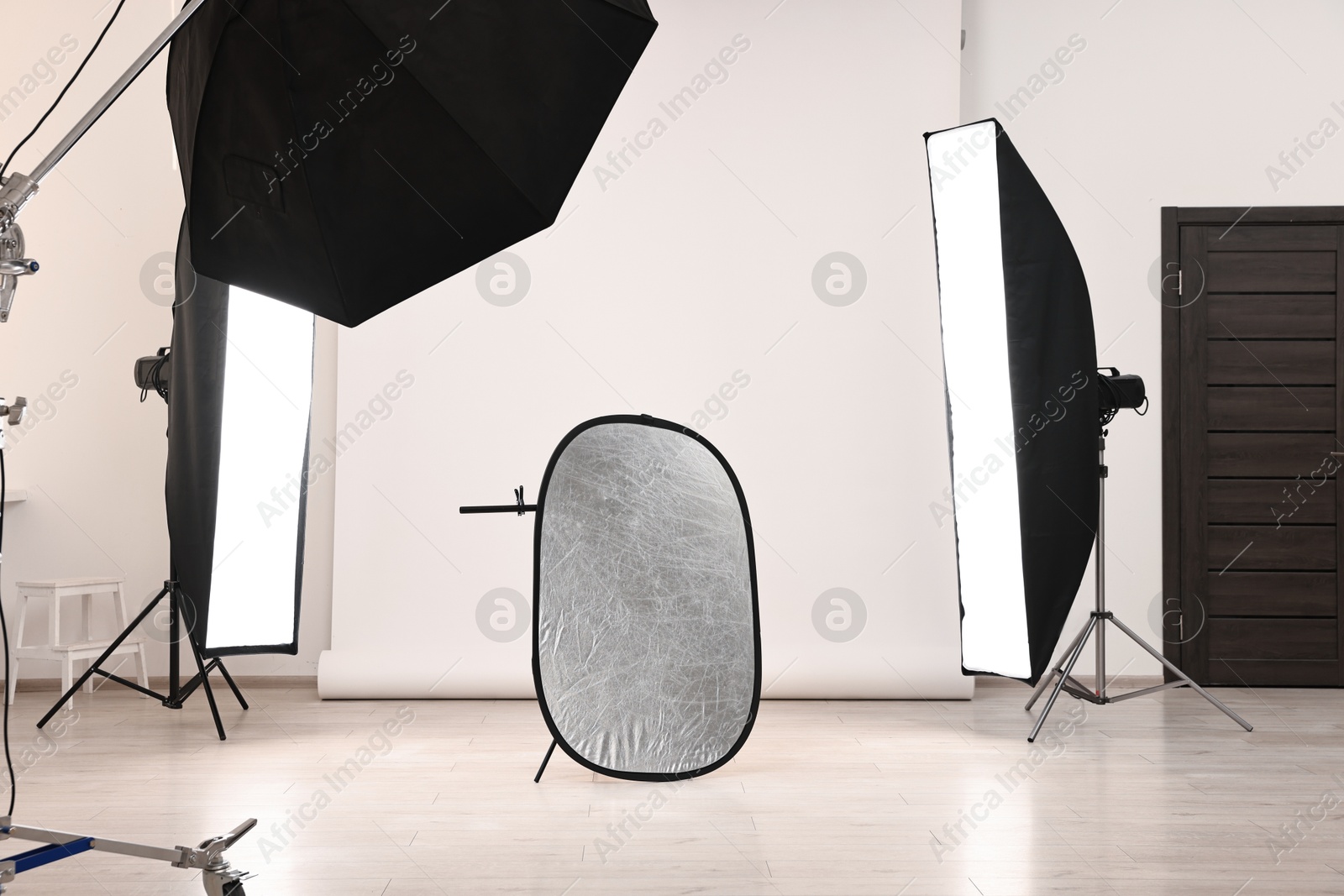 Photo of Professional lighting equipment setup in modern photo studio