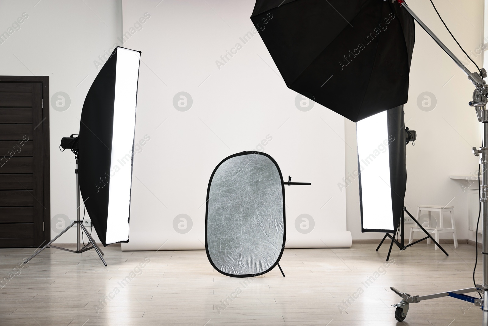 Photo of Professional lighting equipment setup in modern photo studio