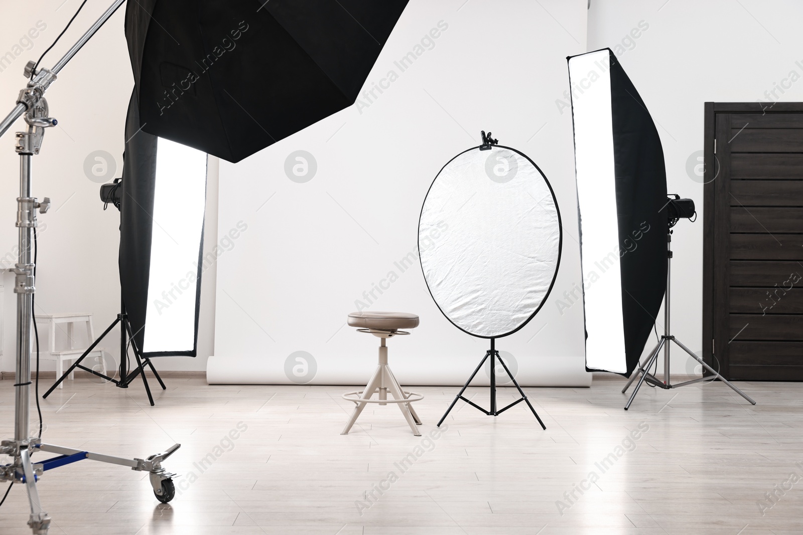 Photo of Professional lighting equipment setup in modern photo studio