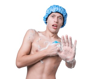 Photo of Man with shower cap and mesh sponge making stop gesture on white background