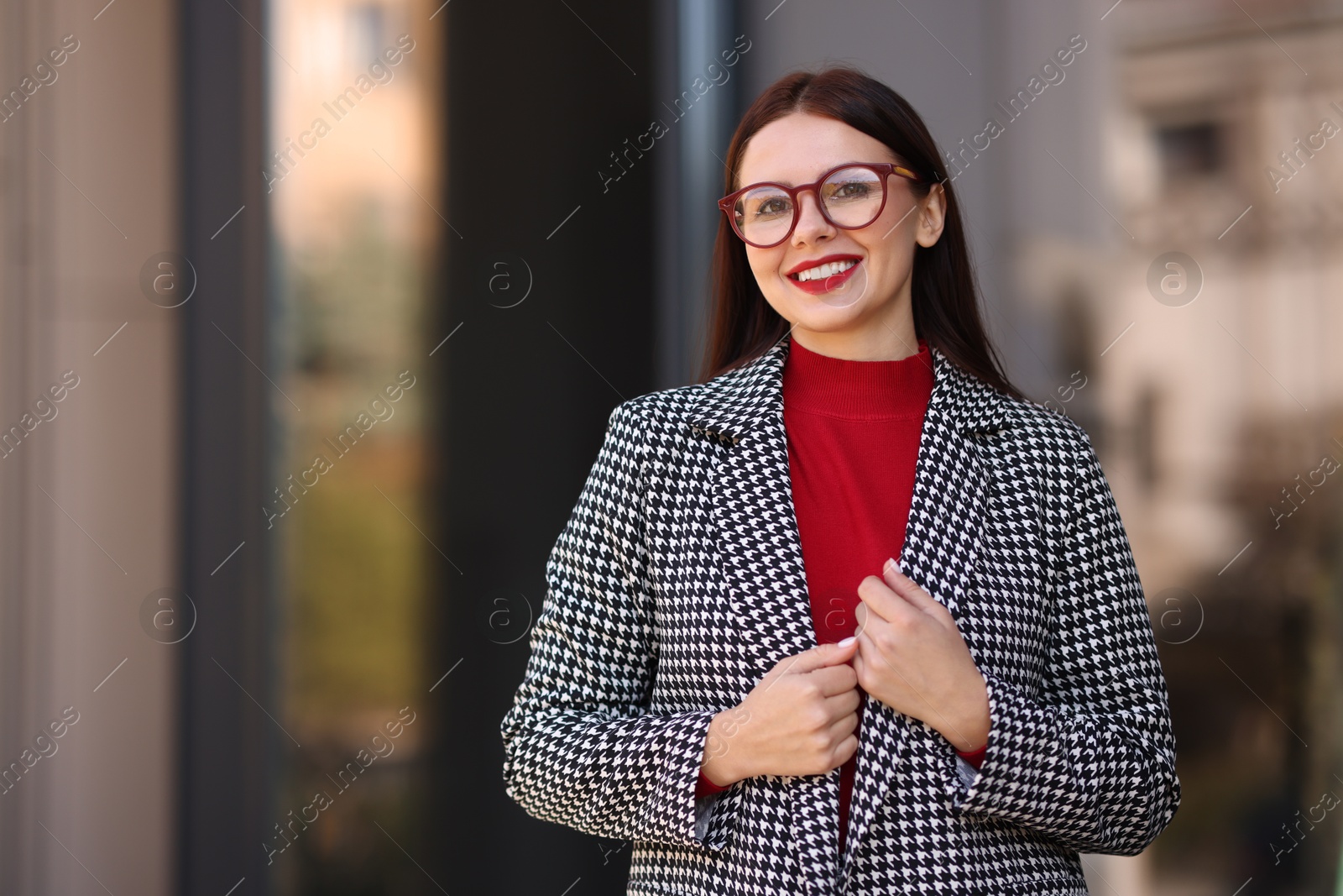 Photo of Beautiful woman in stylish suit outdoors. Space for text