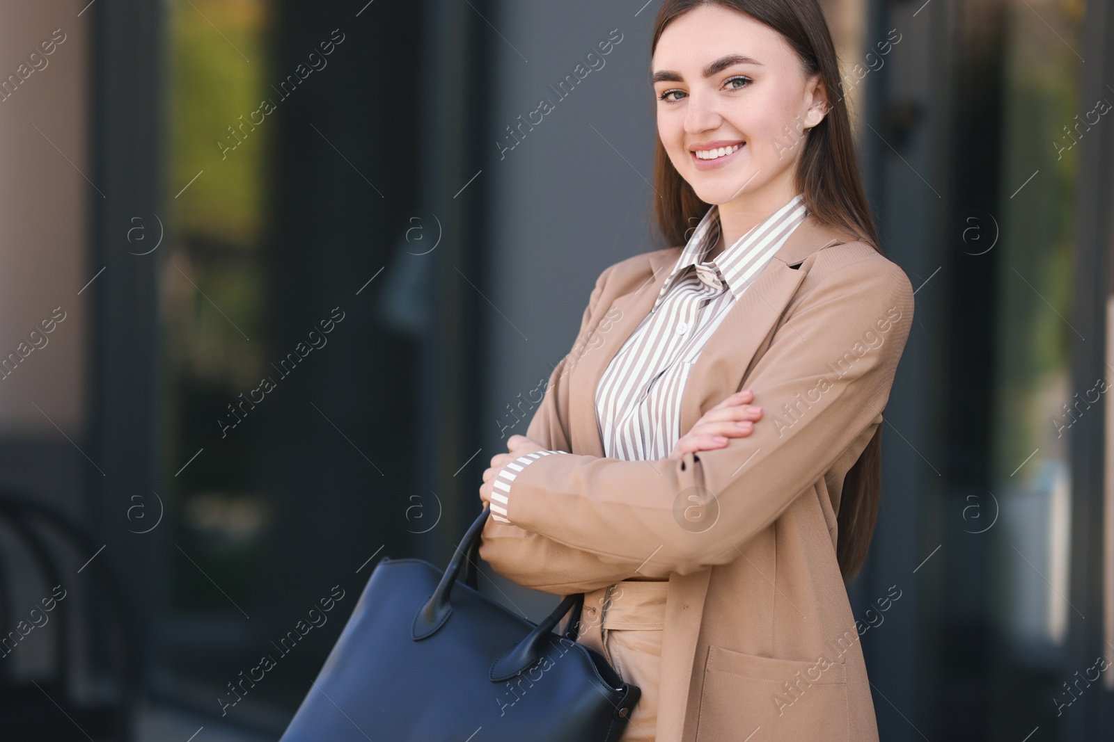 Photo of Beautiful woman in stylish suit outdoors. Space for text