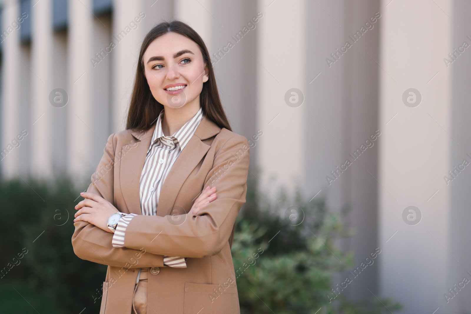 Photo of Beautiful woman in stylish suit outdoors. Space for text