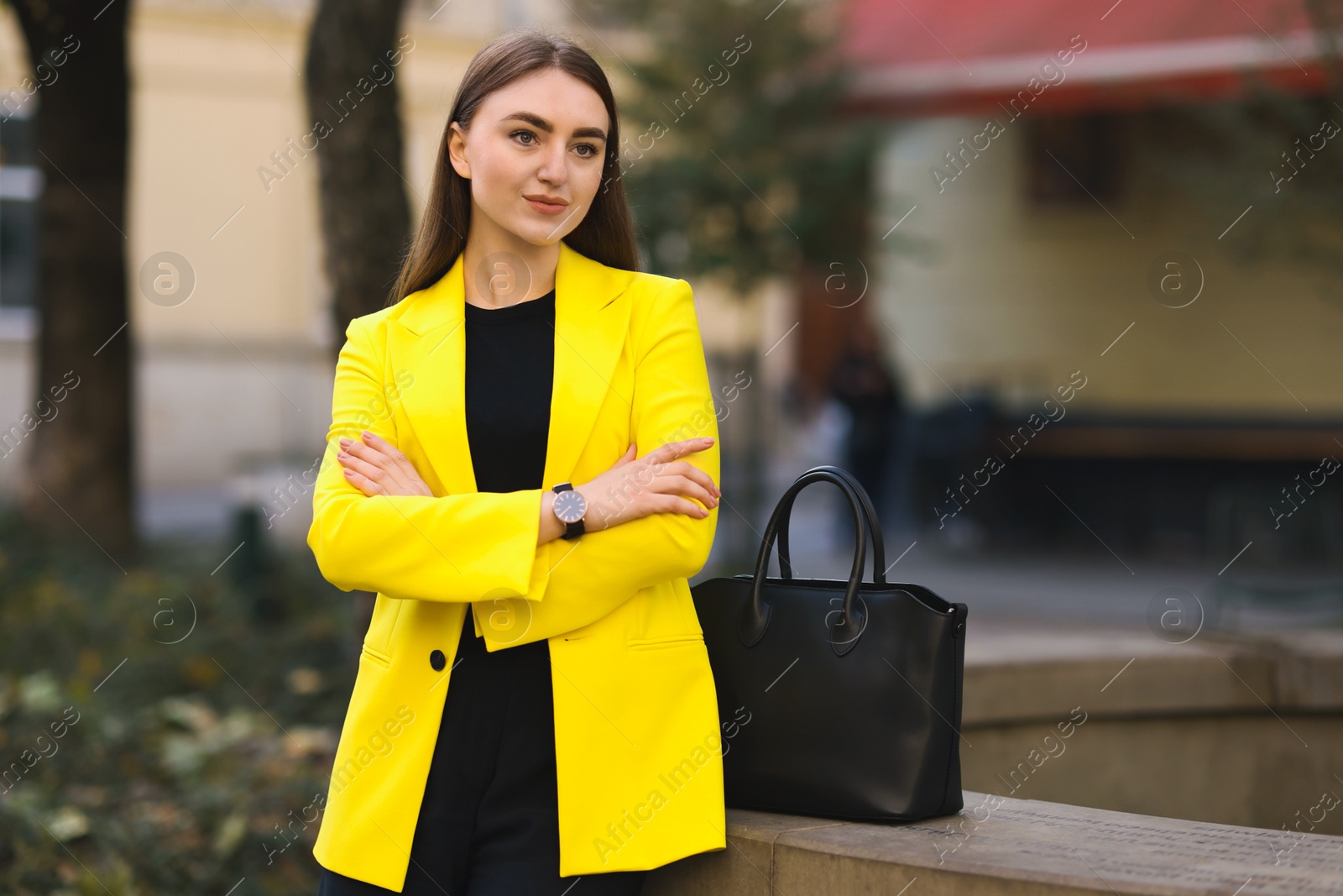 Photo of Beautiful woman in stylish suit outdoors. Space for text