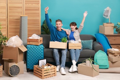 Photo of Happy couple with different stuff in new apartment. Housewarming party