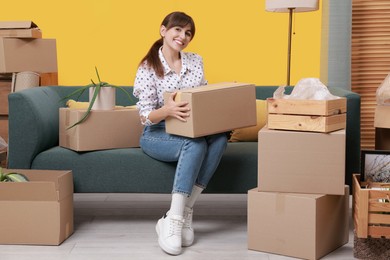 Photo of Happy woman with moving boxes in new apartment. Housewarming party