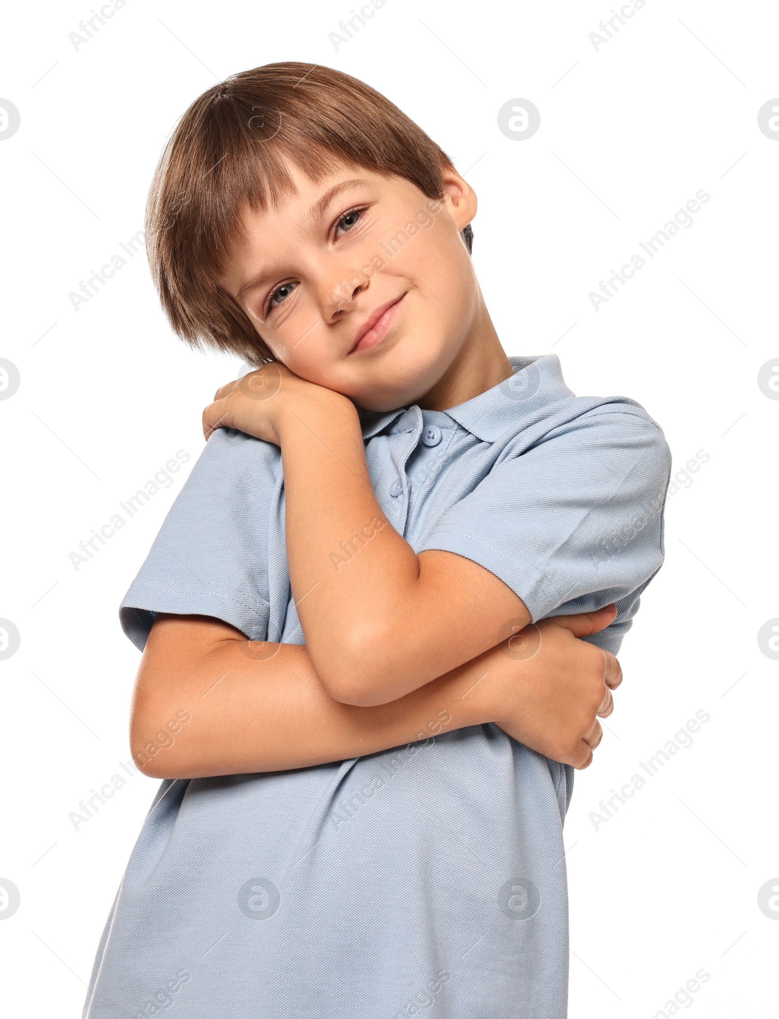 Photo of Cute little boy hugging himself on white background