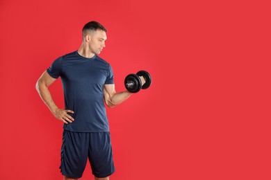 Photo of Man exercising with barbell on red background, space for text